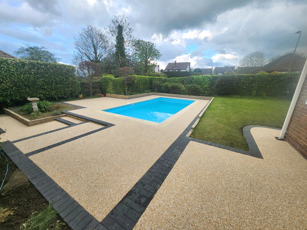 Resin patio around pool Resin patio around pool